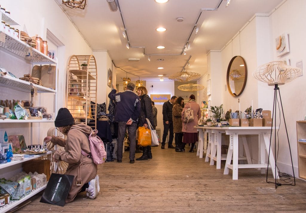 Blue Patch sustainable shop with crowd of people Christmas shopping