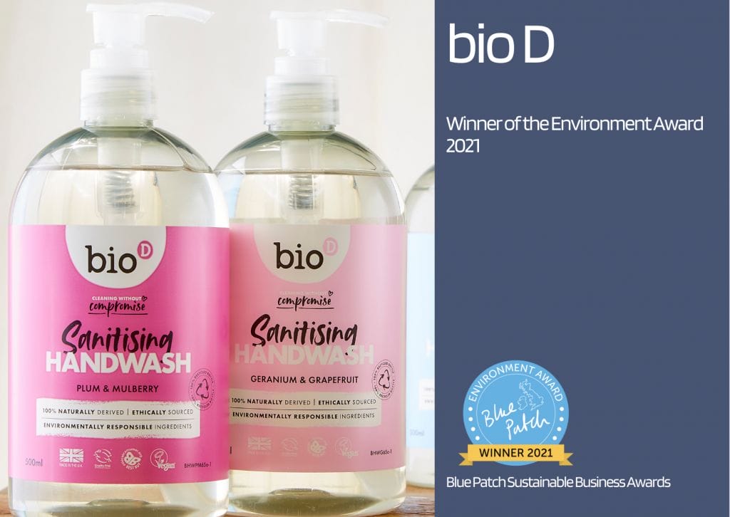 two pink Bio D bottles with sustainable cleaning liquid created from post-consumer waste.