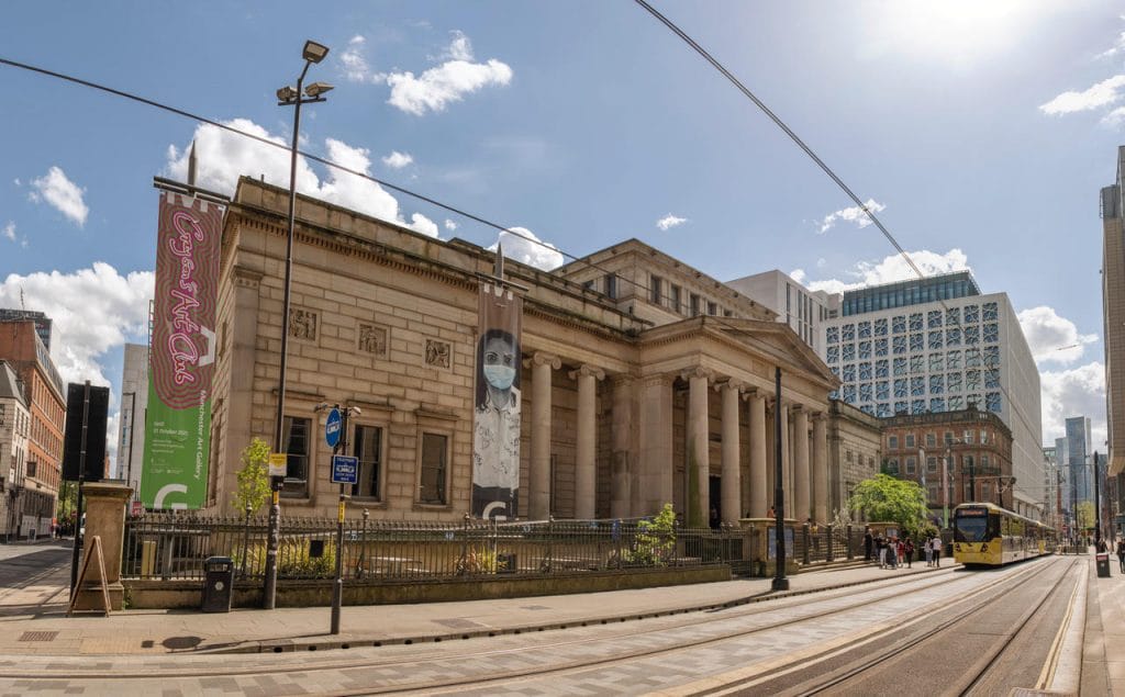 Blue patch Happy Planet Store atManchester Art gallery, with a blue sky