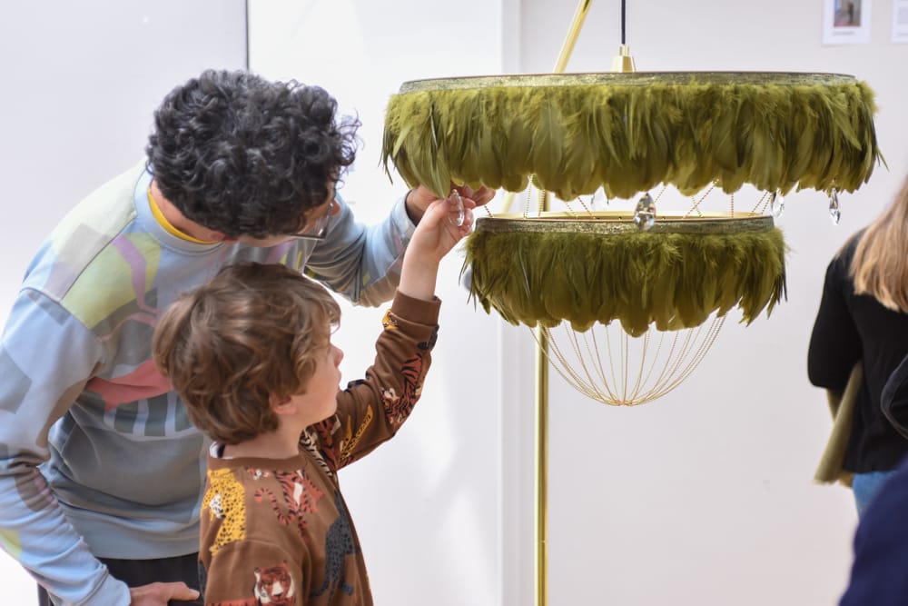 person and child look at a lamp by Coldharbour Lights at Dulwich Picture Gallery, Blue Patch's Sustainable Arts & Crafts Showcase 