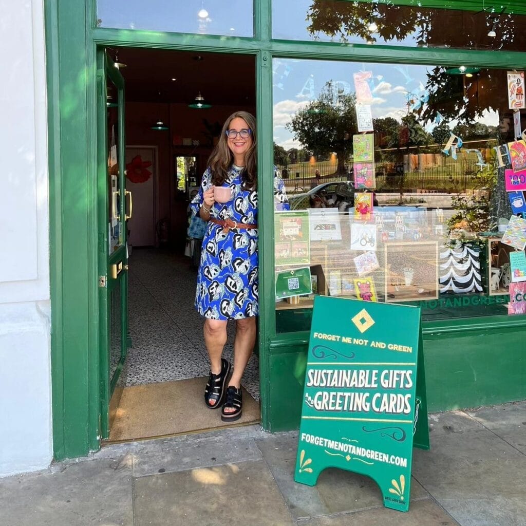 Sam in the door of her shop